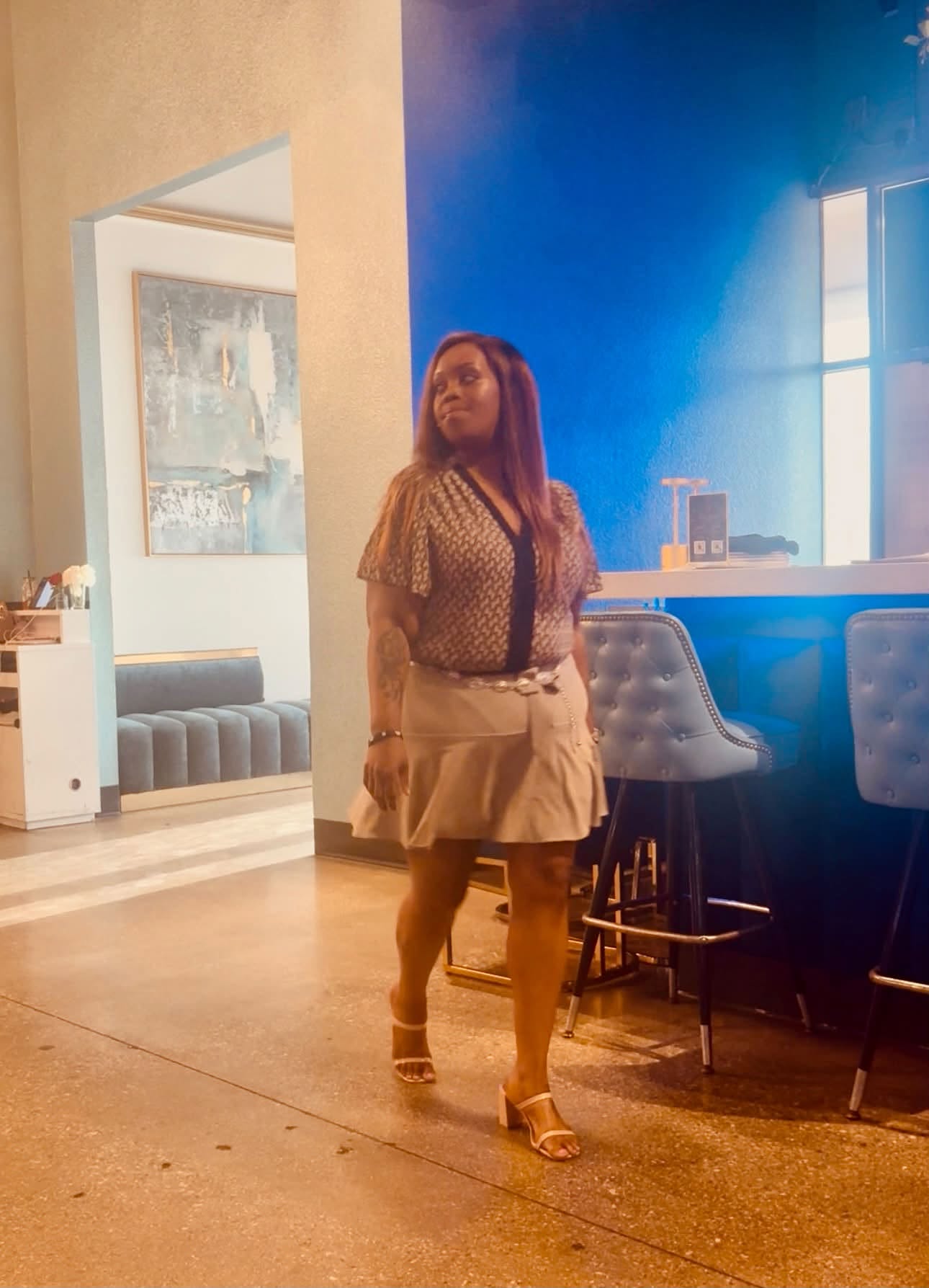 Sarah Swann walking into a professional event space
